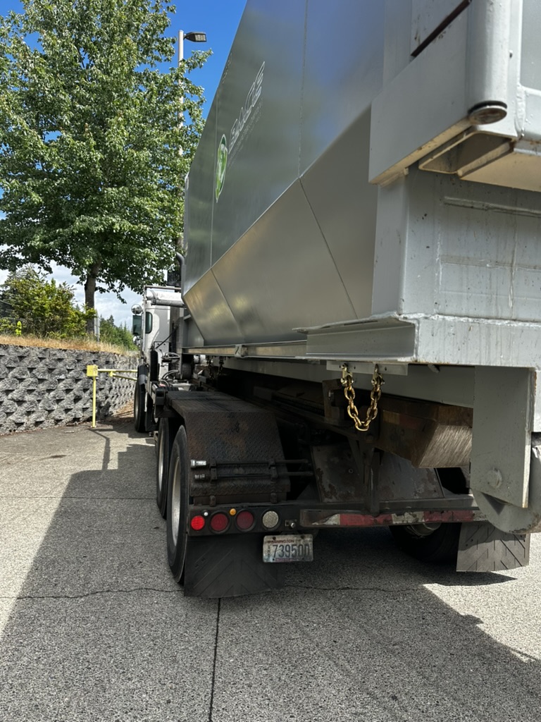 Commercial trash compactor positioned for structural and mechanical service